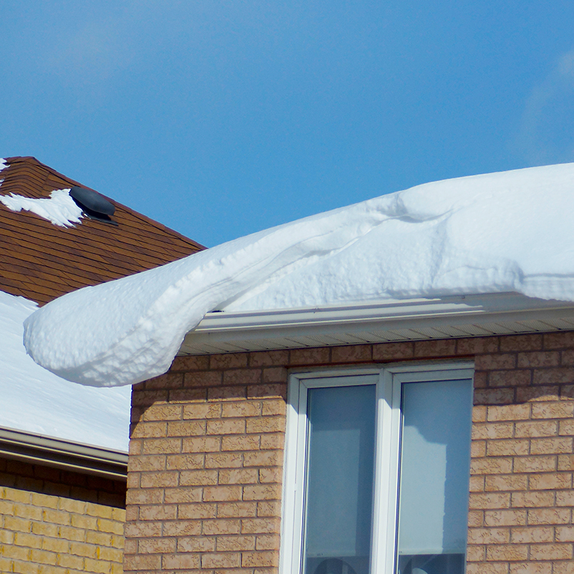 snow on roof ready to fall off